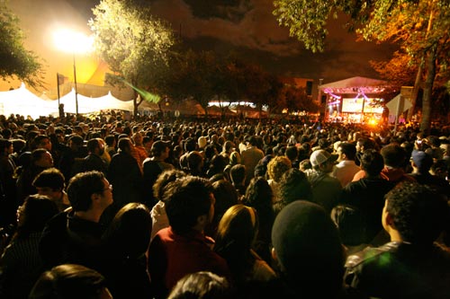 People watch the stage from the plaza outside Tijuana's CECUT cultural center.